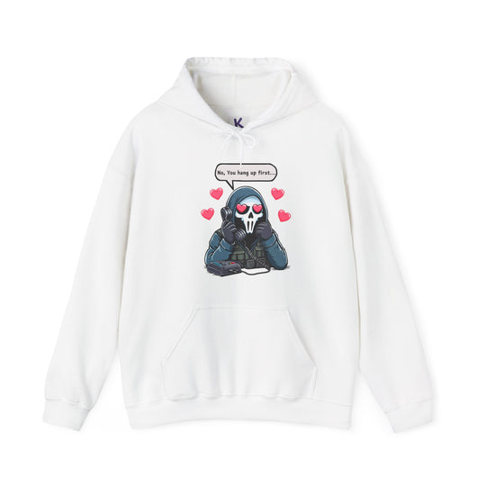 A white hoodie featuring a playful graphic of a cartoon reaper holding a phone with the text “No, you hang up first” in bold, black letters. Ideal for fans of dark humor and edgy streetwear style.