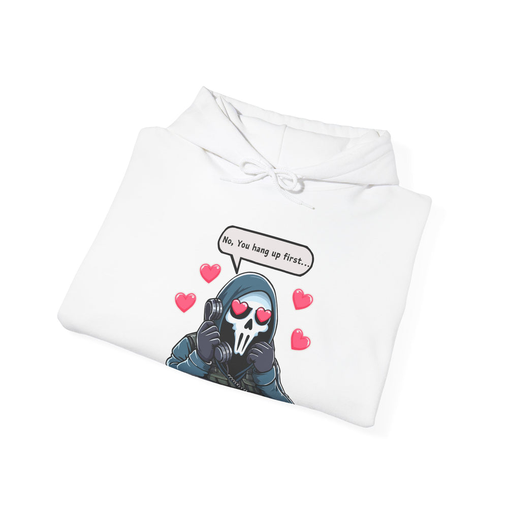 A white hoodie featuring a playful graphic of a cartoon reaper holding a phone with the text “No, you hang up first” in bold, black letters. Ideal for fans of dark humor and edgy streetwear style.
