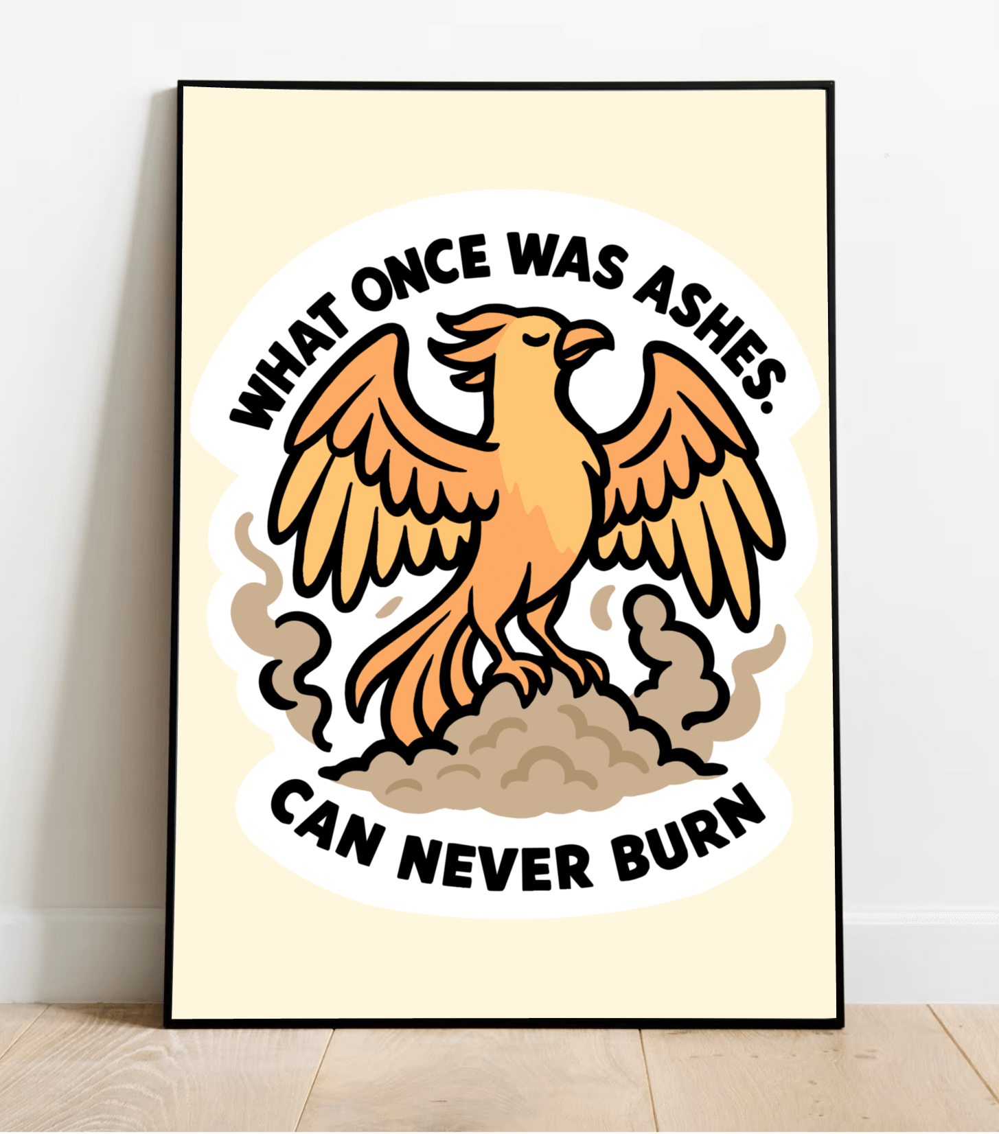 Framed wall art print featuring a bold orange phoenix rising from ashes, with the quote "What once was ashes can never burn" in strong black lettering, set against a light neutral background.