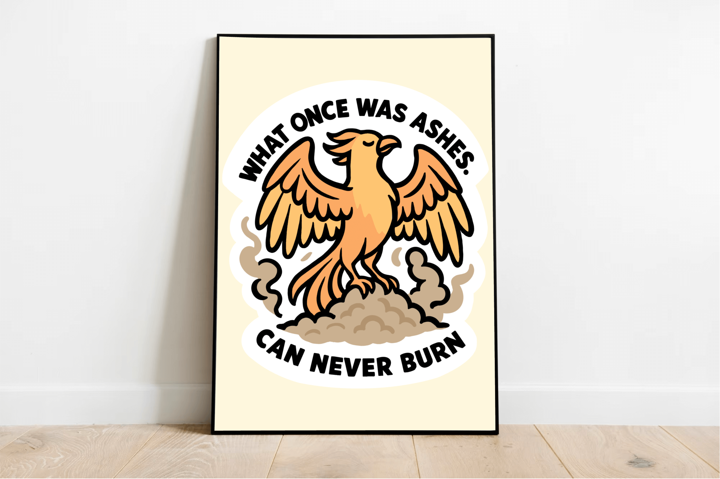 Framed wall art print featuring a bold orange phoenix rising from ashes, with the quote "What once was ashes can never burn" in strong black lettering, set against a light neutral background.