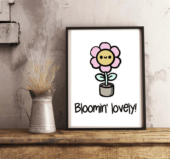 Introducing the "Bloomin' Lovely Print" – a delightful touch of British charm that's sure to bring a smile to your face! This adorable cartoon-style flower showcases a cheerful pink bloom with the happiest little face, all nestled in its cozy gray pot. The playful phrase "Bloomin' lovely!" dances beneath it, capturing the essence of positivity and growth. Perfectly placed on a light wooden floor against a crisp white wall, this print is just waiting to brighten up your space with its whimsical vibe.