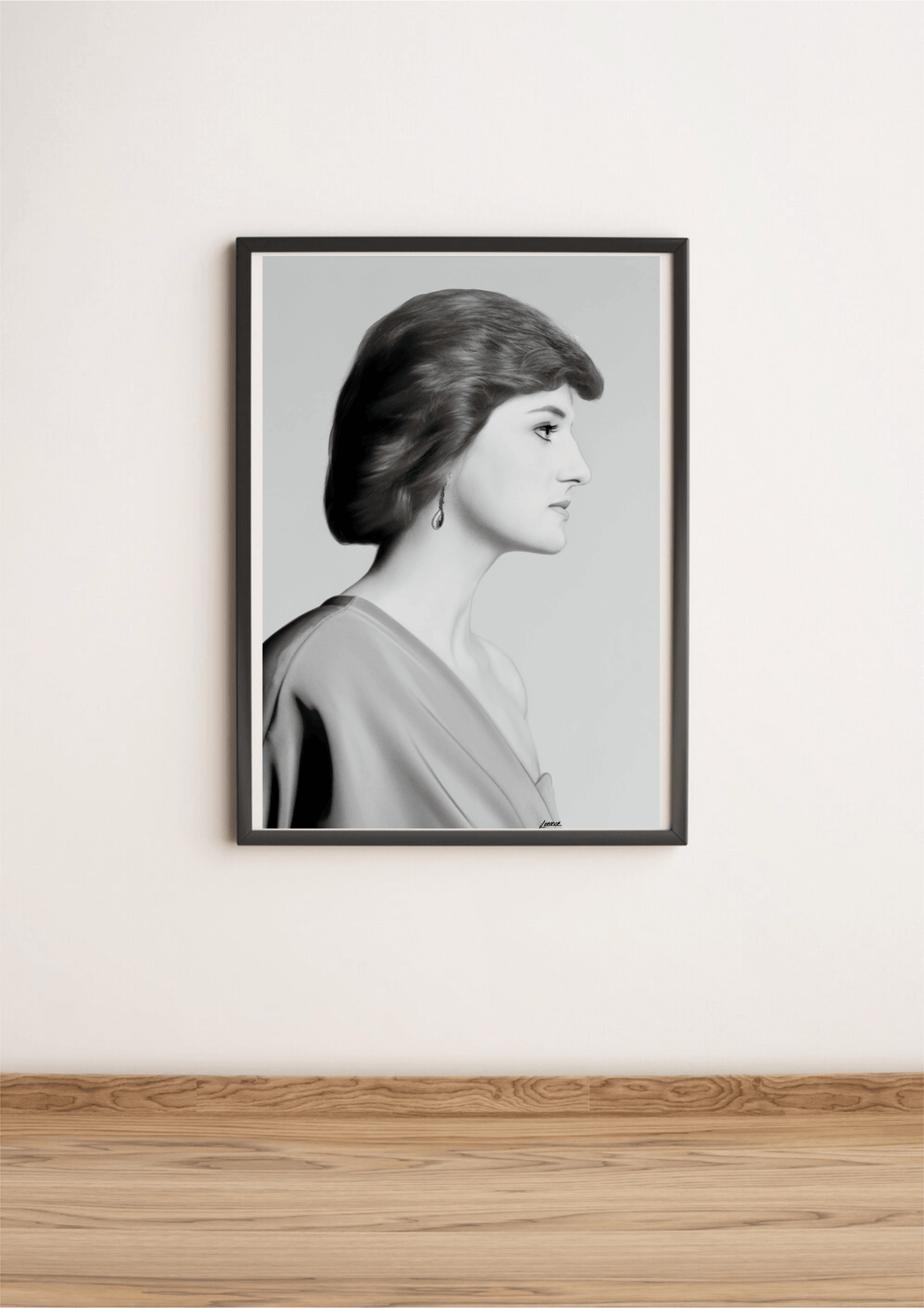 Introducing "Eternal Grace - Handcrafted Princess Diana Print," a stunning black and white framed portrait that radiates timeless elegance. This captivating piece showcases a woman in profile, set beautifully on a wooden floor against a pristine white wall. With short, wavy locks and an elegant off-the-shoulder dress reminiscent of Princess Diana's iconic style, this print truly embodies the essence of royalty. A delicate dangling earring adds just the right touch of grace, making this subtly tilted image p