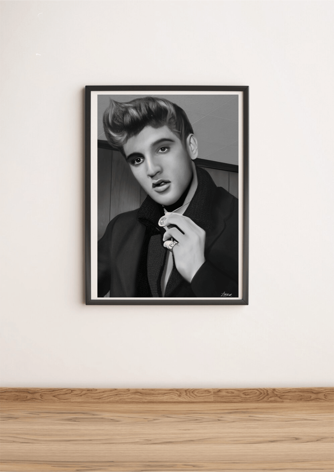 Discover the magic of The King with our stunning black and white portrait, aptly named "The King Forever - Handcrafted Elvis Print." This captivating artwork beautifully captures a young man channeling an Elvis vibe, complete with perfectly styled hair and an intense pose. Dressed in a sleek suit, he brings an air of mystery as he holds a ring to his lips. Even unframed, this print commands attention as it leans elegantly against a crisp white wall on a light wood floor. Its superior printing quality highli