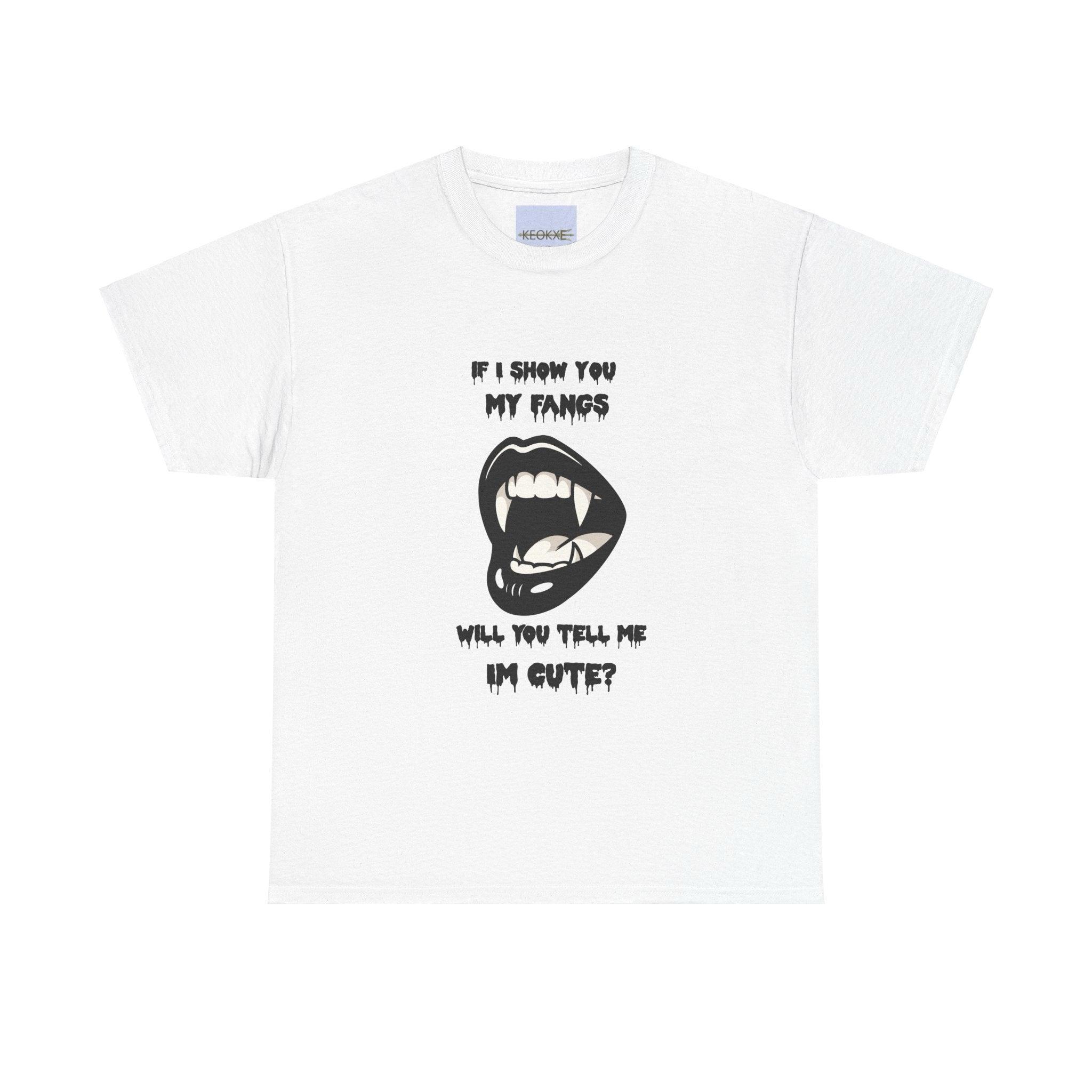White T-shirt featuring a cartoon vampire smile with fangs, along with the phrase 'If I Show You My Fangs, Will You Tell Me I'm Cute?' A playful, gothic-inspired design for those who love quirky humor.