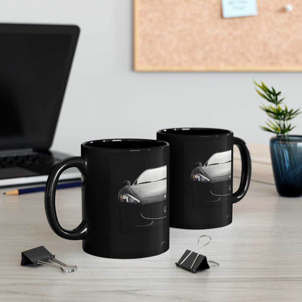 Stylish black ceramic mug that reveals a Maserati car design when heated, perfect for luxury car enthusiasts who enjoy a touch of surprise with their coffee.