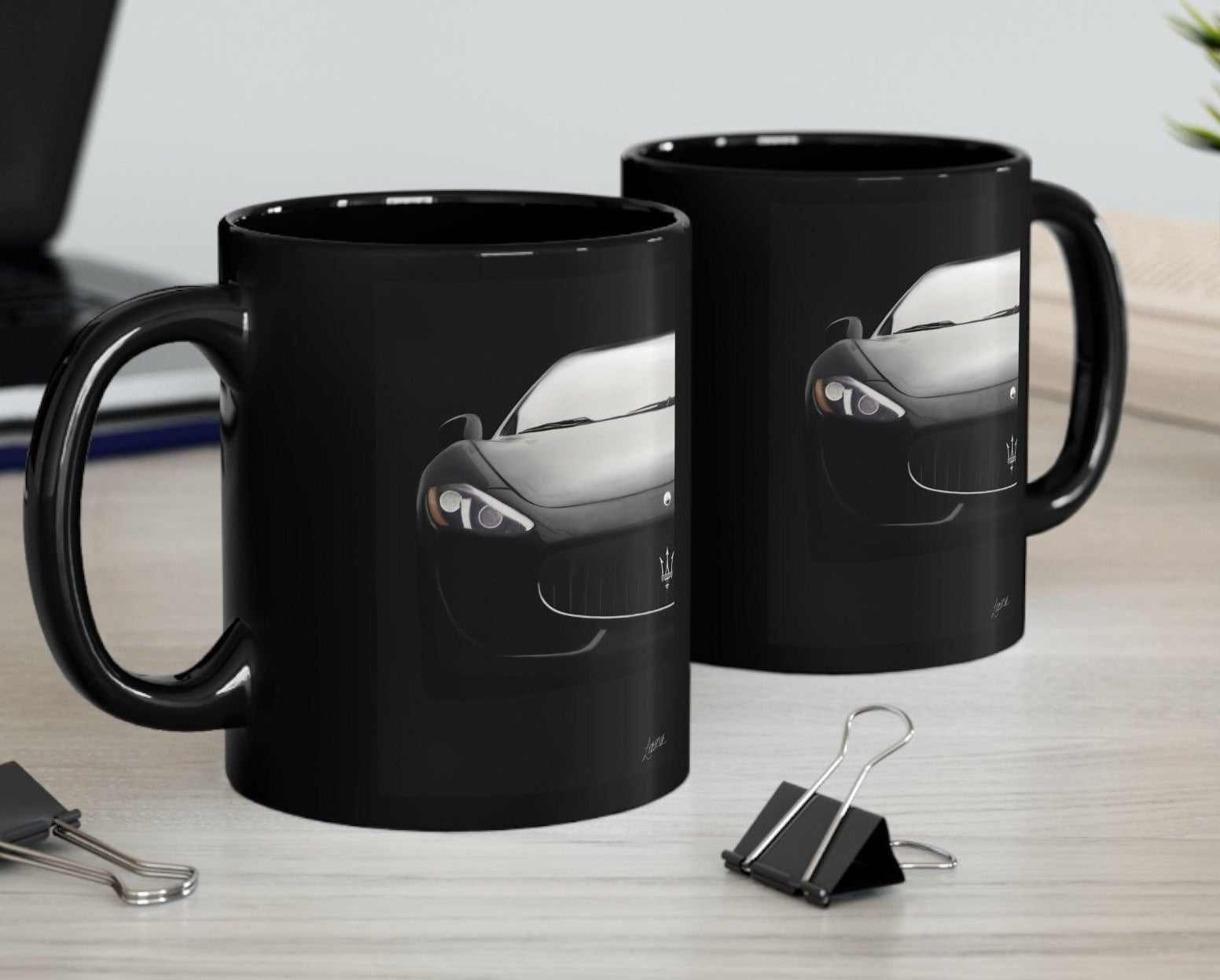 Stylish black ceramic mug that reveals a Maserati car design when heated, perfect for luxury car enthusiasts who enjoy a touch of surprise with their coffee.