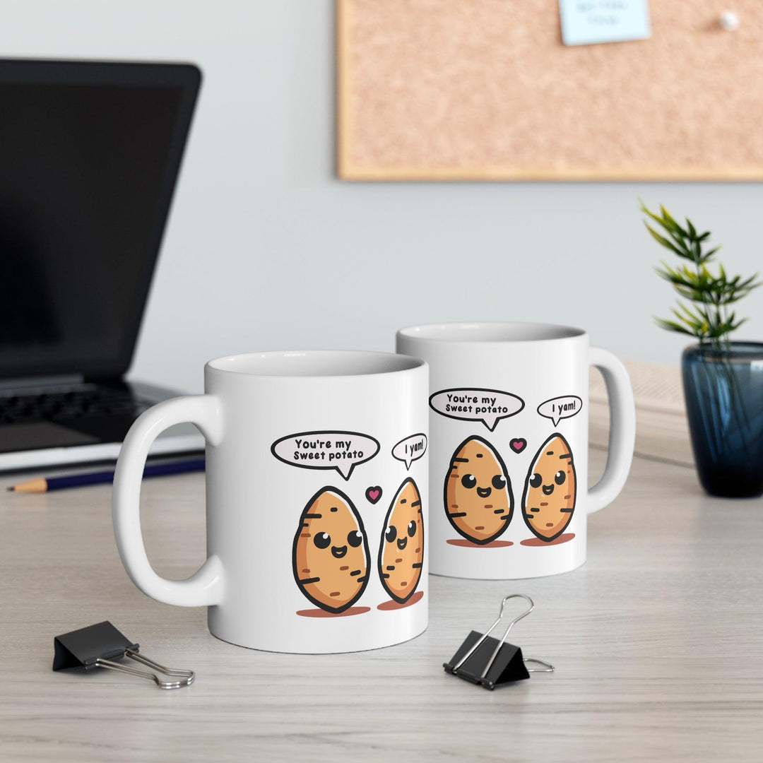Fun white ceramic mug with two cartoon yams and a pun-filled text bubble, perfect for fans of playful and food-themed designs.