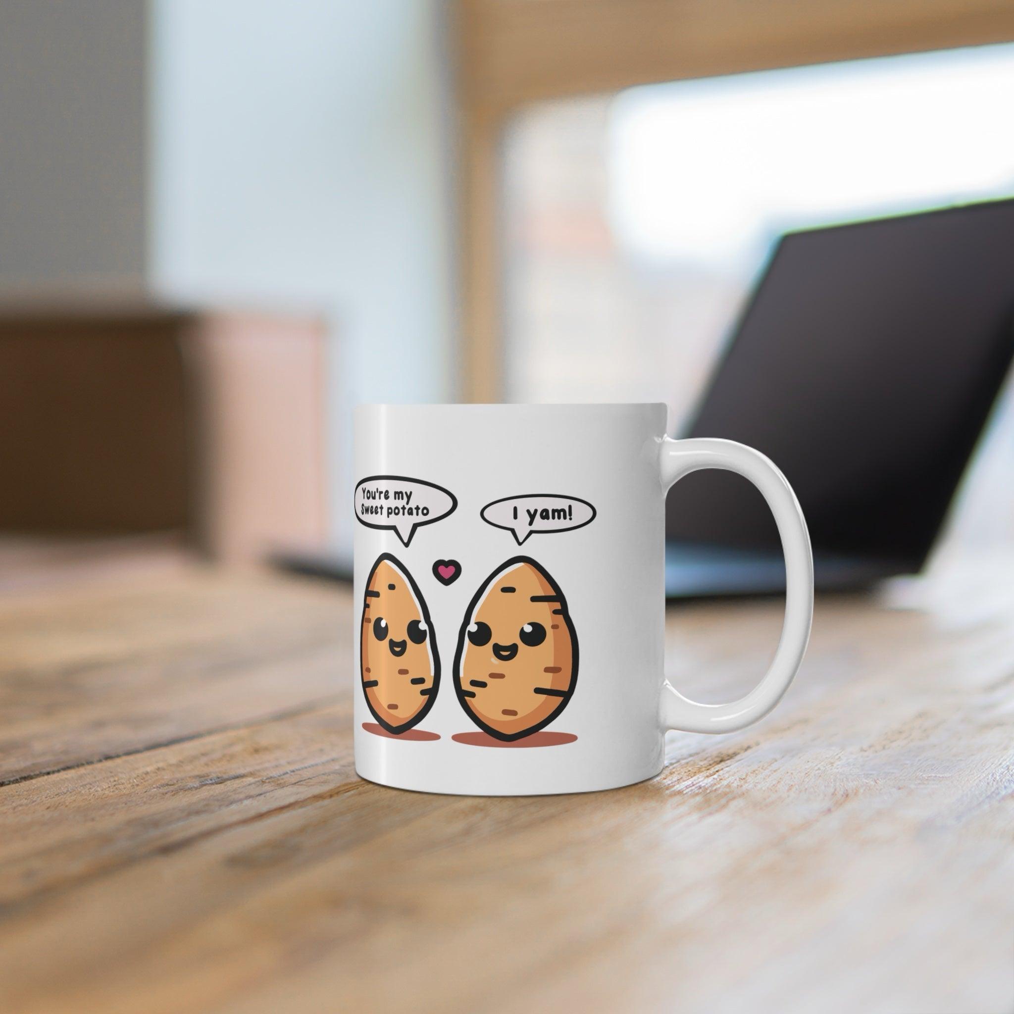 Fun white ceramic mug with two cartoon yams and a pun-filled text bubble, perfect for fans of playful and food-themed designs.