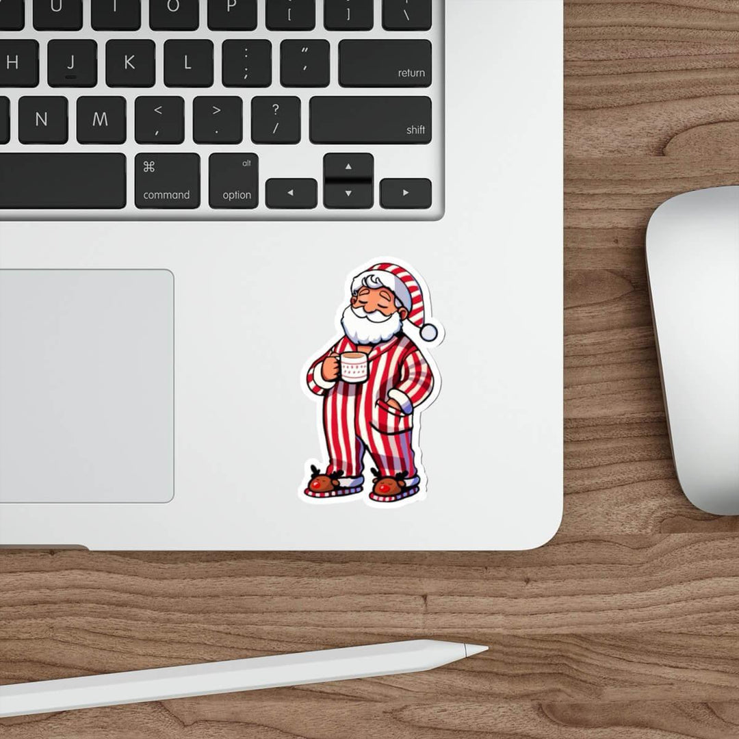 Cozy Santa waterproof sticker featuring Santa in red-striped pajamas holding a hot drink, perfect for decorating laptops, water bottles, and journals with festive holiday cheer.