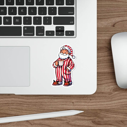 Cozy Santa waterproof sticker featuring Santa in red-striped pajamas holding a hot drink, perfect for decorating laptops, water bottles, and journals with festive holiday cheer.