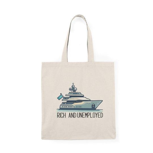 A cream-colored tote bag featuring a humorous design with the text 'Rich and Unemployed' alongside an illustration of a luxury yacht. This playful graphic contrasts wealth with unemployment, making it a fun accessory for those who appreciate irony.