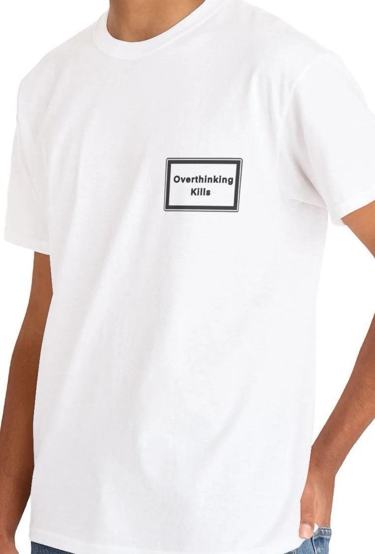 White cotton T-shirt featuring a minimalist design with the text 'Overthinking Kills' on the chest pocket. A stylish yet bold statement piece for anyone battling overthinking or embracing mindfulness - Baby Keo.