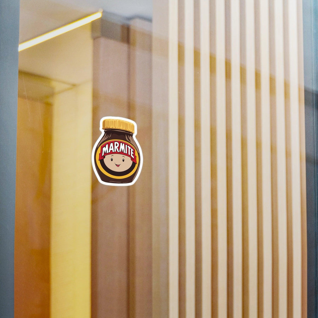 Fun waterproof sticker featuring a smiling Marmite jar with a face. Ideal for fans of this iconic spread, perfect for laptops, notebooks, or water bottles - Baby Keo