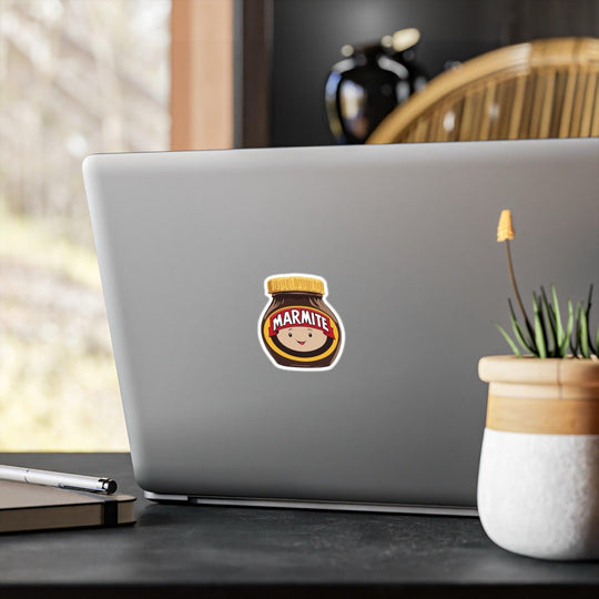 Fun waterproof sticker featuring a smiling Marmite jar with a face. Ideal for fans of this iconic spread, perfect for laptops, notebooks, or water bottles - Baby Keo
