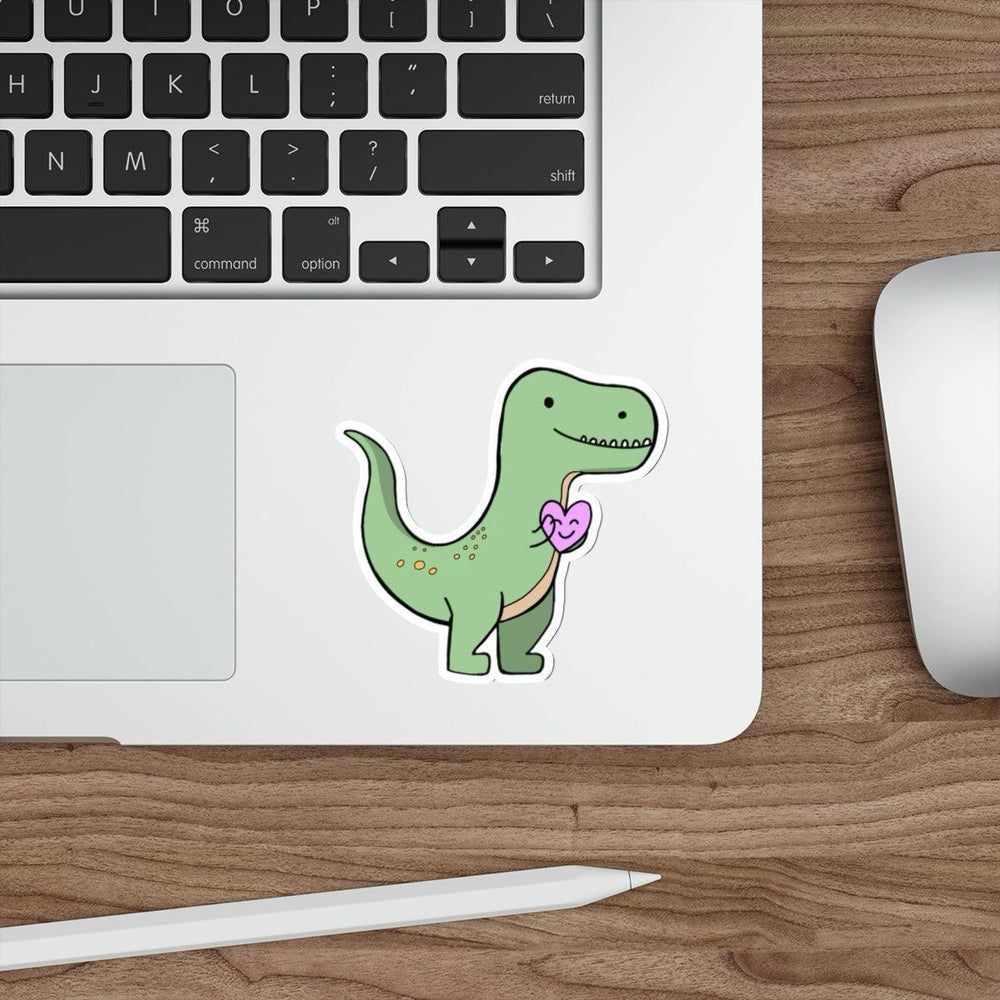T-Rex Waterproof Sticker: A cute green T-Rex holding a pink heart, giving off adorable prehistoric vibes. Suitable for kids and dinosaur enthusiasts alike. Baby Keo.