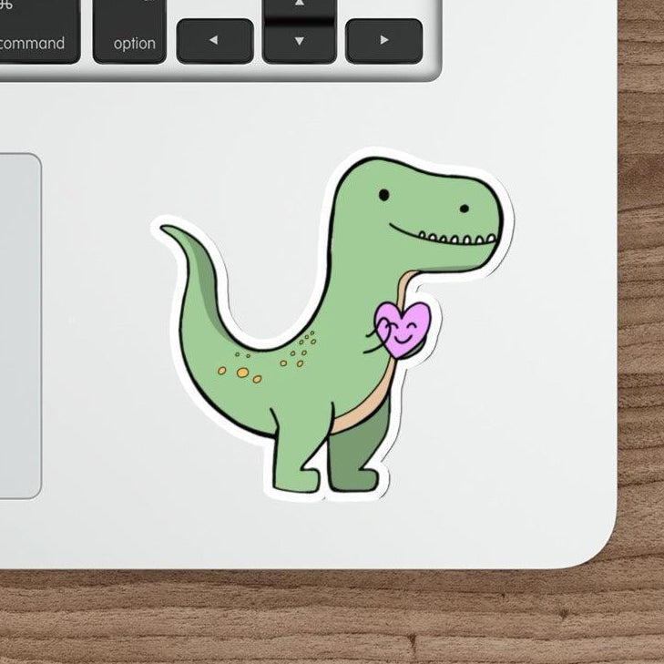 T-Rex Waterproof Sticker: A cute green T-Rex holding a pink heart, giving off adorable prehistoric vibes. Suitable for kids and dinosaur enthusiasts alike.  KEOLIX 