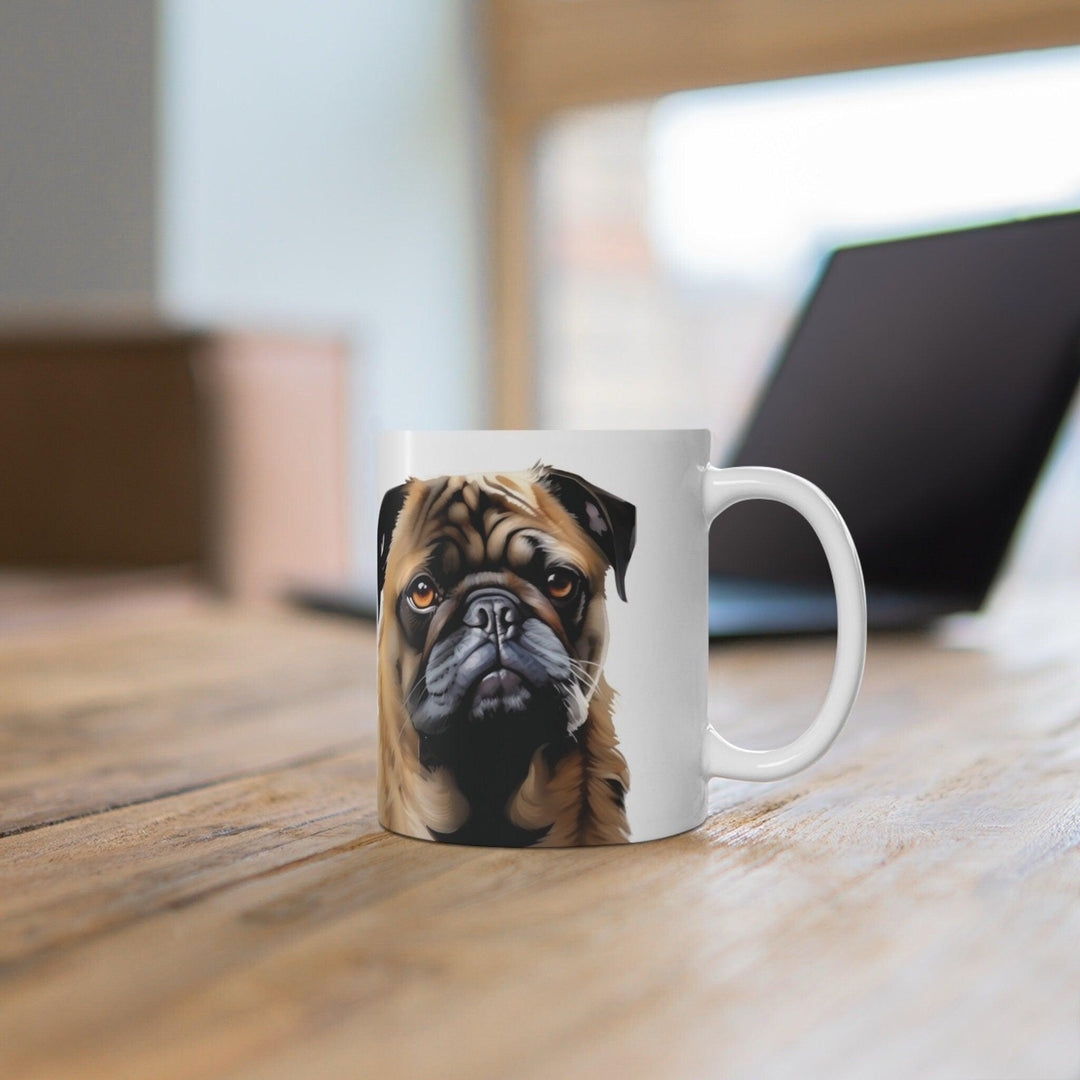 White ceramic mug featuring a detailed illustration of a cute pug, perfect for dog lovers who want to showcase their affection for the breed