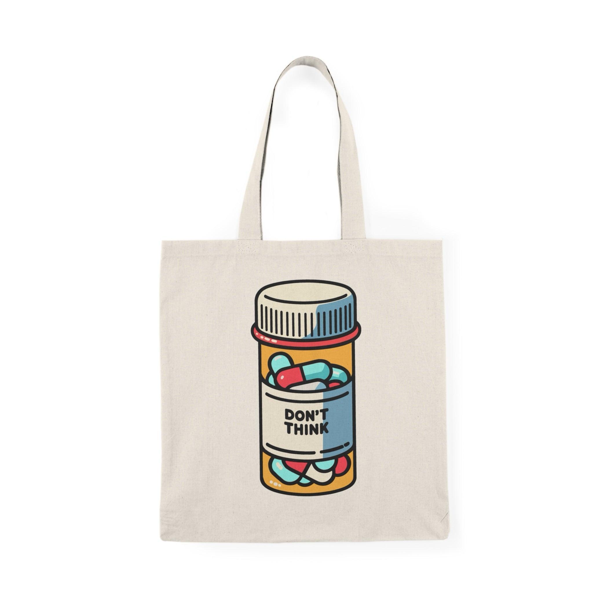 Tote bag featuring a humorous illustration of a pill bottle labeled 'Don't Think.' The playful design and bold colors create a lighthearted accessory, perfect for those who appreciate a fun take on mental health and self-care, making it a great addition to everyday carry.