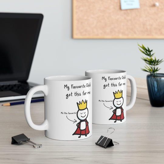 Cute white ceramic mug with a cartoon child character and the text &