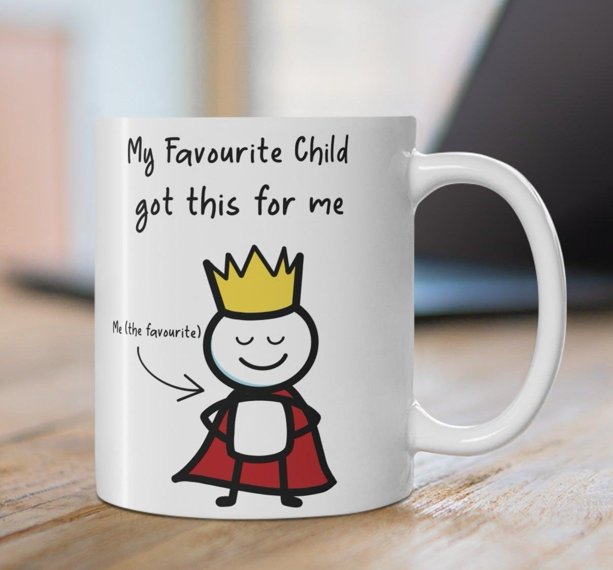 Cute white ceramic mug with a cartoon child character and the text 'My Favourite Child Got Me This,' a perfect humorous gift for parents