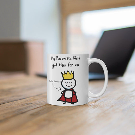Cute white ceramic mug with a cartoon child character and the text &