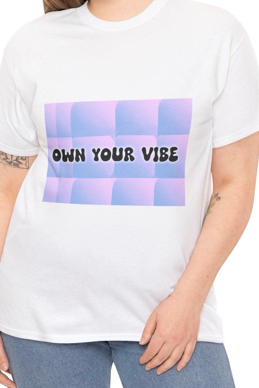 White T-shirt with a pastel gradient background and the phrase 'Own Your Vibe.' A modern, feel-good design encouraging self-expression and confidence."