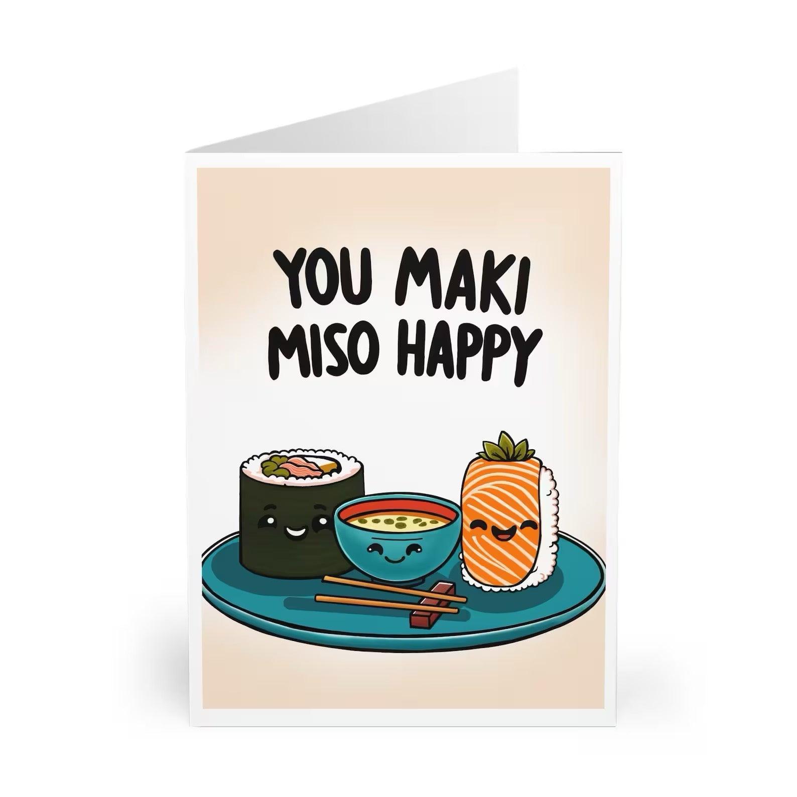 Adorable food-themed greeting card featuring sushi and miso soup with the pun 'You maki miso happy.' Ideal for food lovers or as a playful message for someone special - Baby Keo