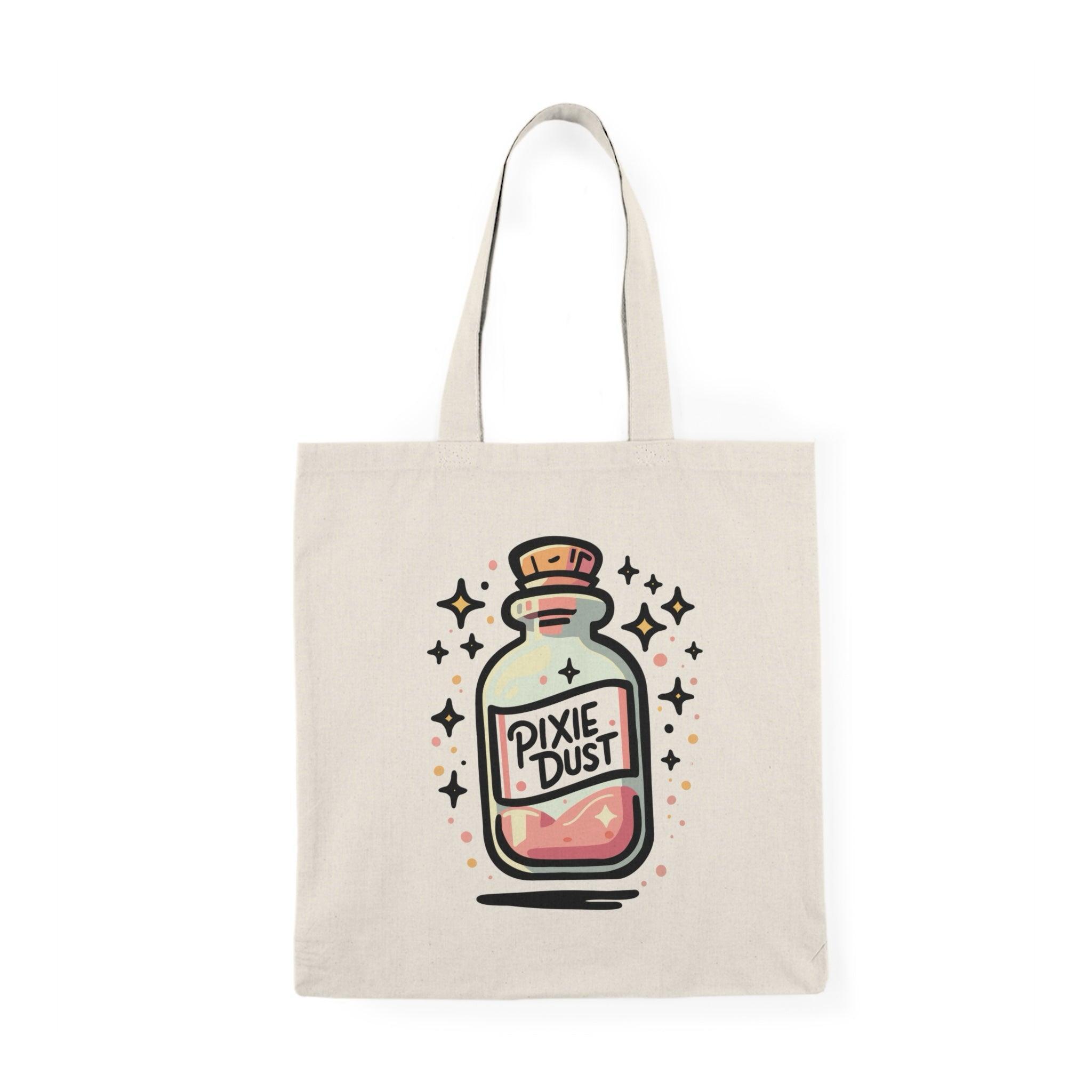 A natural canvas tote bag showcasing a whimsical design of a potion bottle labeled 'Pixie Dust,' surrounded by sparkling stars. The enchanting graphic captures the essence of magic and fantasy, perfect for those who love all things mystical