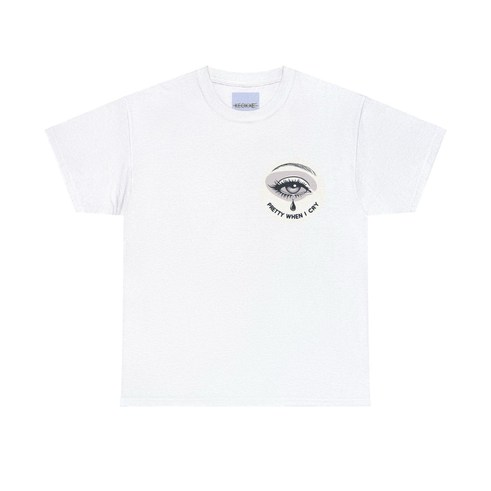 White T-shirt featuring a small, subtle illustration of a single eye with teardrops, along with the phrase 'Pretty When I Cry.' A delicate and emotional design, perfect for expressing vulnerability with a hint of irony.