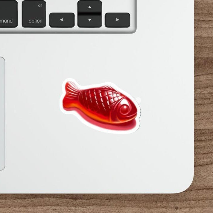 Swedish Fish Waterproof Sticker: A fun, vibrant red Swedish fish candy sticker, designed to bring a pop of color to any surface. Perfect for lovers of quirky and cute stickers. KEOLIX 