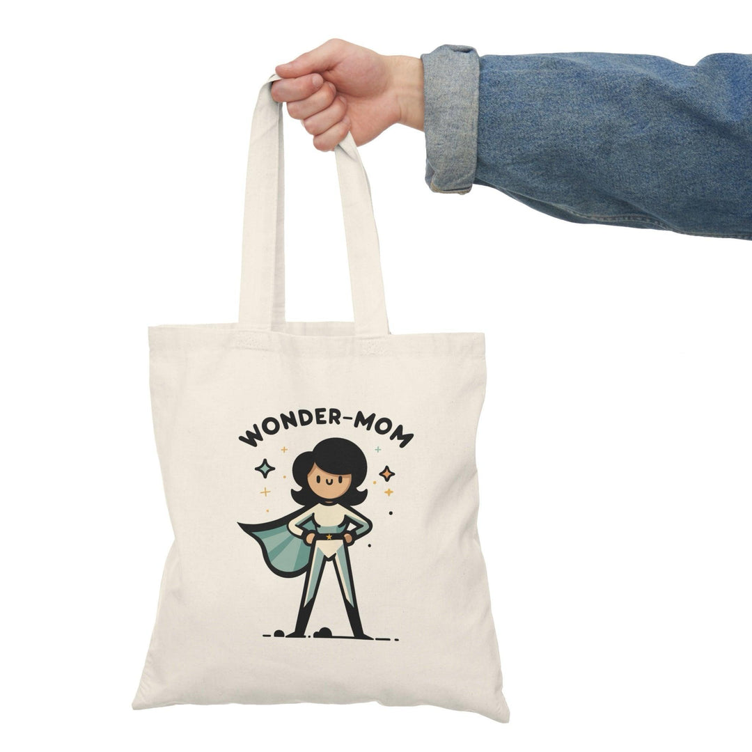 A natural canvas tote bag showcasing a playful illustration of a superhero mom with the text 'Wonder Mum.' The charming design celebrates the superhero qualities of mothers, making it a perfect gift for mothers or anyone who appreciates their hard work.