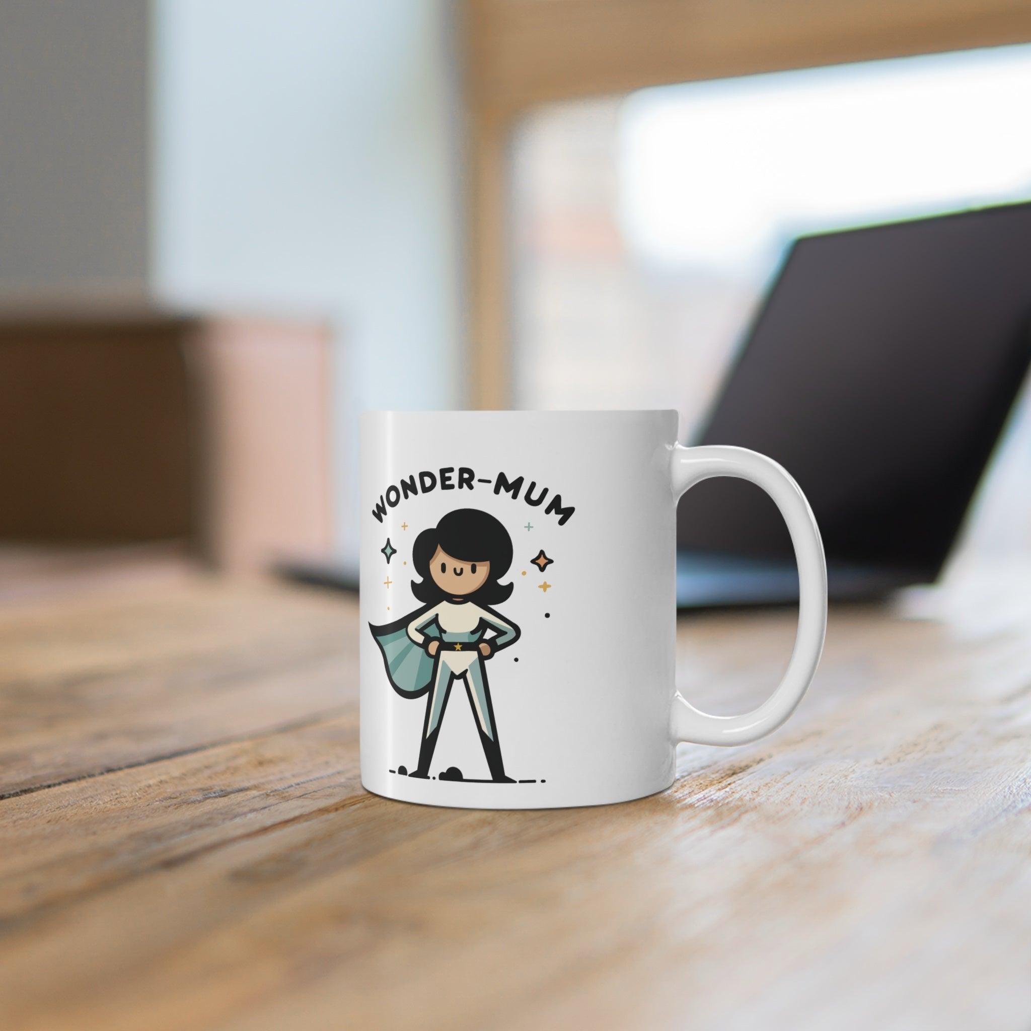 'Wonder Mom/Mum' Mug - "White ceramic mug with a cartoon Wonder Mom/Mum character, a fun and empowering gift for moms who do it all."