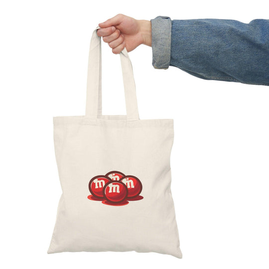 Fun and playful canvas tote bag featuring the classic M&M’s candy logo in bright colors. Perfect for casual outings, shopping trips, or as a gift for candy lovers. Durable and eco-friendly - Baby Keo