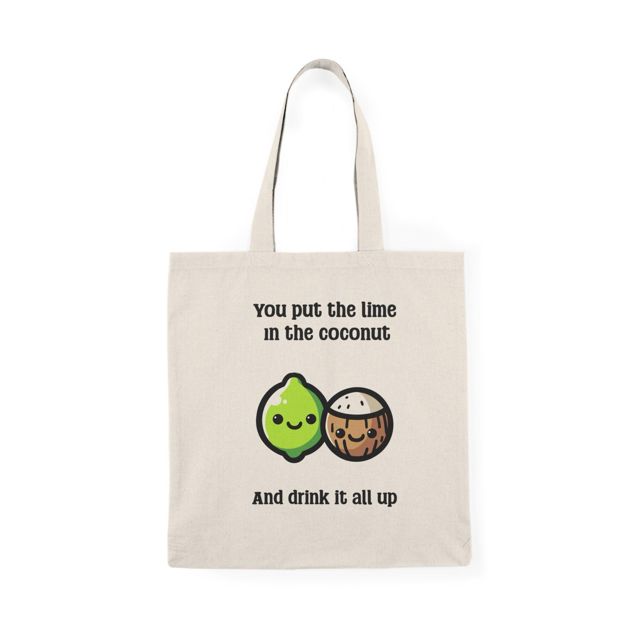 A cream tote bag showcasing a humorous illustration of a smiling lime character with the phrase 'You put the lime in the coconut and drink it all up.' The fun design combines tropical vibes with a cheeky message, ideal for beach lovers and cocktail enthusiasts.