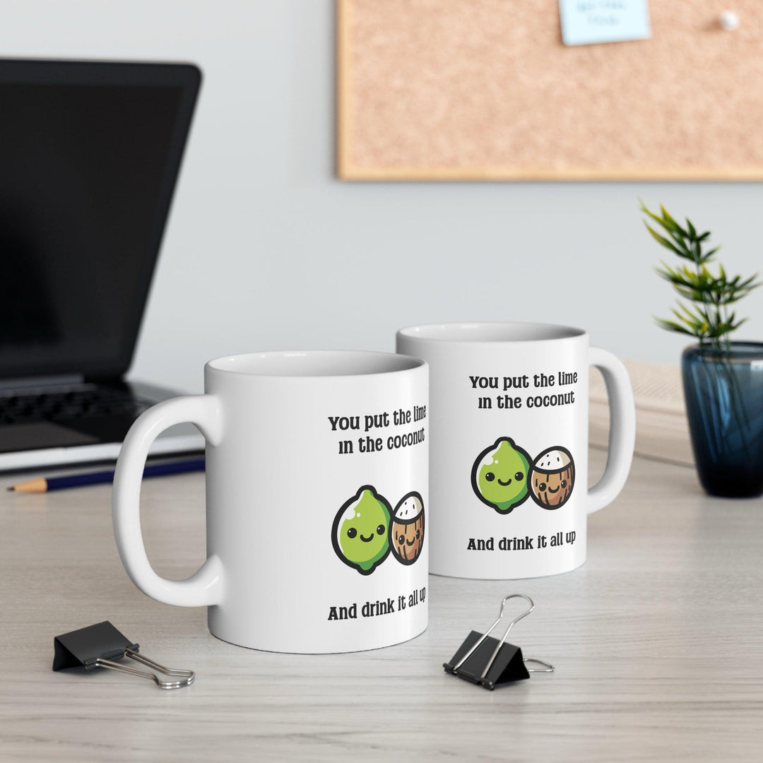 Fun ceramic mug featuring a cheerful lime and coconut illustration with the phrase 'You put the lime in the coconut and drink it all up.' A quirky gift or perfect addition to your morning coffee routine - Baby Keo.
