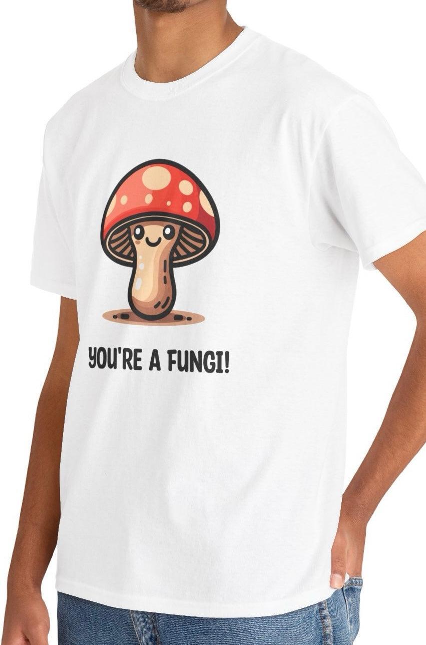 White T-shirt featuring a cartoon mushroom with the phrase 'You're A Fungi.' A pun-filled, light-hearted design for nature lovers and fans of playful humor