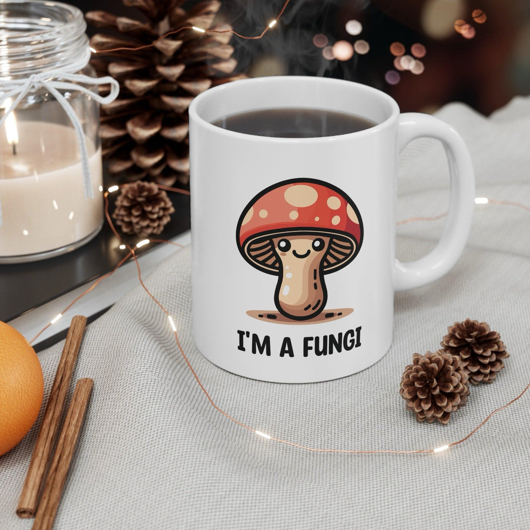 Fun ceramic mug featuring a cute mushroom character and the pun 'I'm a Fungi.' Perfect for adding a playful touch to your morning coffee, ideal for nature lovers and pun enthusiasts - Baby Keo.