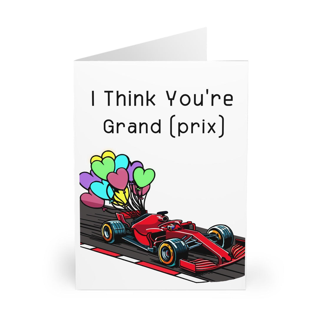 Playful greeting card featuring a Formula 1 race car and the phrase 'I Think You’re Grand (Prix).' Ideal for racing fans or as a fun compliment with a twist - Baby Keo.