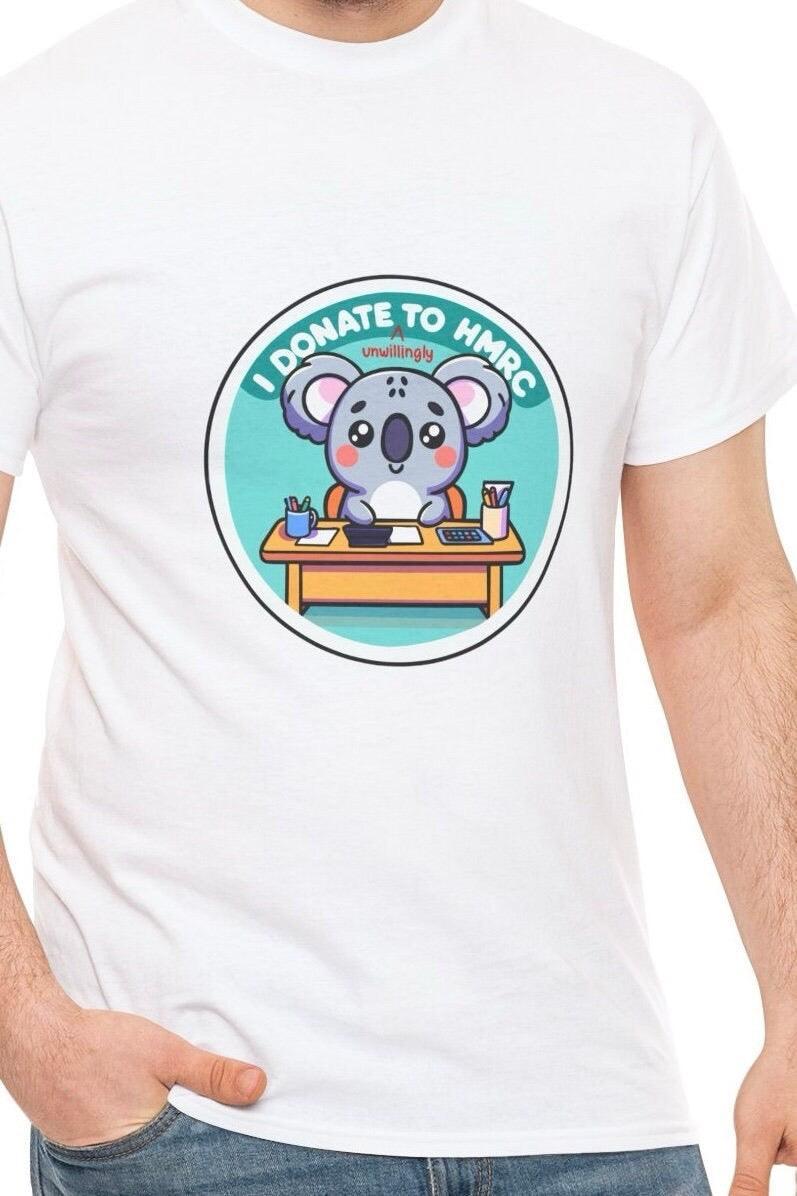 White T-shirt with a cartoon piggy bank illustration and the phrase 'I Donate (Unwillingly) to HMRC.' A humorous design highlighting the frustration of paying taxes, perfect for those with a sense of humor about financial matters