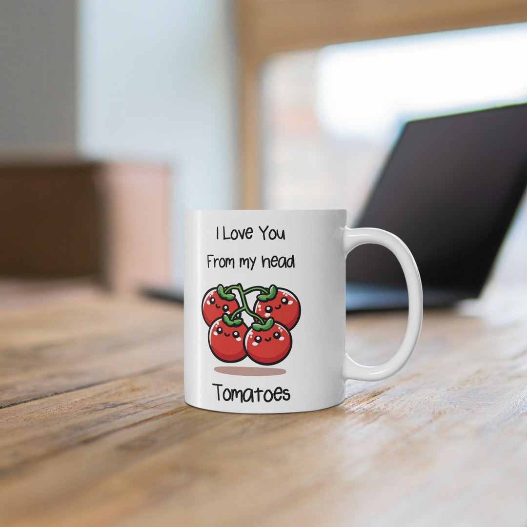 Cute white ceramic mug with a smiling tomato illustration and the pun 'I Love You from My Head Tomatoes,' ideal for spreading love with a smile."