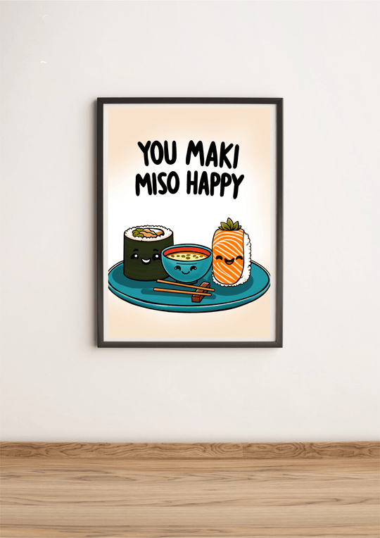 Introducing the delightful "You Maki Miso Happy" Artwork Print! This charming piece features an adorable illustration of beaming sushi rolls alongside a cheerful miso soup bowl, all perfectly perched on a teal plate with chopsticks at the ready. Above this joyful scene, you'll find the playful phrase "You maki miso happy" in bold black letters, adding a fun touch to any room. Set against a soft beige backdrop, this framed print elegantly rests on a wooden floor, ready to bring warmth and smiles to your spac