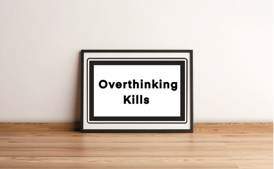 Add a touch of modern flair to your space with the "Overthinking Kills" art print! This striking piece, with its simple black border, rests elegantly against a crisp white wall on a cozy wooden floor. The bold black text stands out beautifully, serving as both a stylish decor element and a thoughtful reminder to seek mental clarity. Perfect for minimalist enthusiasts who love combining artistry with meaningful messages!