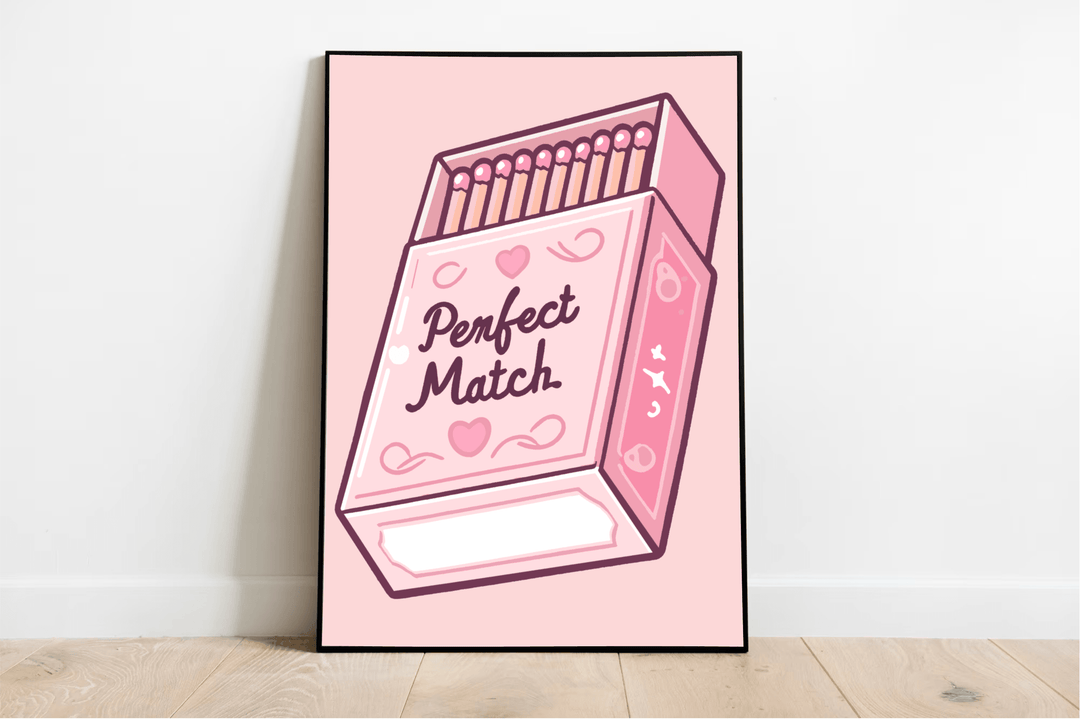 Introducing "The Perfect Match Print"—a charming and whimsically illustrated art piece that's sure to capture hearts! This delightful artwork features a framed pink matchbox set against a soft pink background, adorned with cute hearts, enchanting moons, and twinkling stars. The playful cursive text reads "Perfect Match," adding an extra layer of whimsy. Casually resting on a wooden floor against a pristine white wall, it radiates an aura of lighthearted love that can brighten up any space.