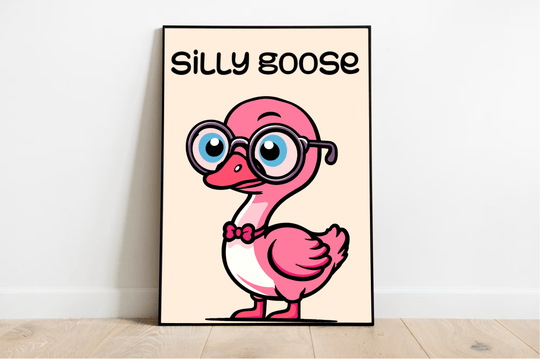 Meet the Silly Goose Print! This delightful framed poster showcases a playful cartoon pink goose rocking some oversized round glasses and a snazzy red bow tie. It's confidently perched on a wooden floor, set against a crisp white wall backdrop. Above our fashionable feathered friend, "SILLY GOOSE" pops in vibrant colors, infusing whimsical charm into this Sunshine print. The minimalist light beige background really lets the fun design take center stage!