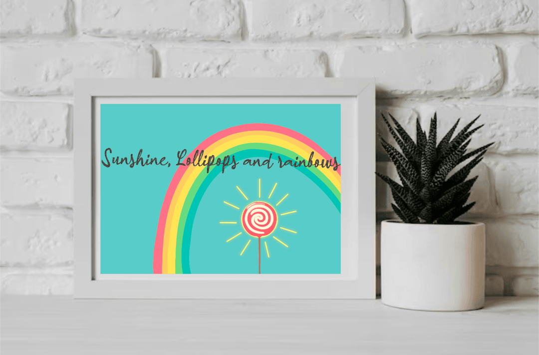 Bright and cheerful art print featuring a rainbow and lollipop with the text 'Sunshine, Lollipops, and Rainbows.' Perfect for adding a pop of color and positivity to any room - Baby Keo