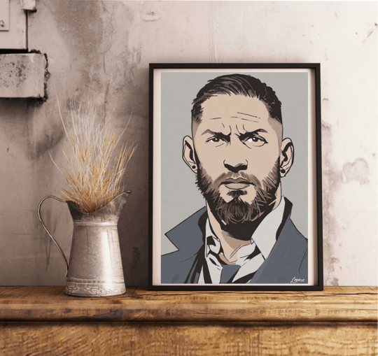 Introducing our "Tom Hardy Cartoon-Styled Portrait" – a charming addition to any space that captures the brooding essence of this iconic actor! This framed illustration features Tom sporting a beard and exuding a serious vibe in his sharp collared shirt and jacket. The print's bold design truly stands out with its vibrant yet muted color palette and striking outlines. Imagine it propped beautifully against a pristine white wall, sitting on a wooden floor, ready to lend an artistic flair to your room. Perfec