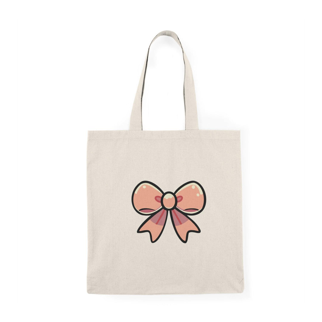 Tote bag featuring a charming design of a large, colorful bow at the center, accented by playful patterns. The whimsical and vibrant artwork adds a touch of fun and femininity, making it a perfect accessory for those who love stylish and cute details in their everyday carry