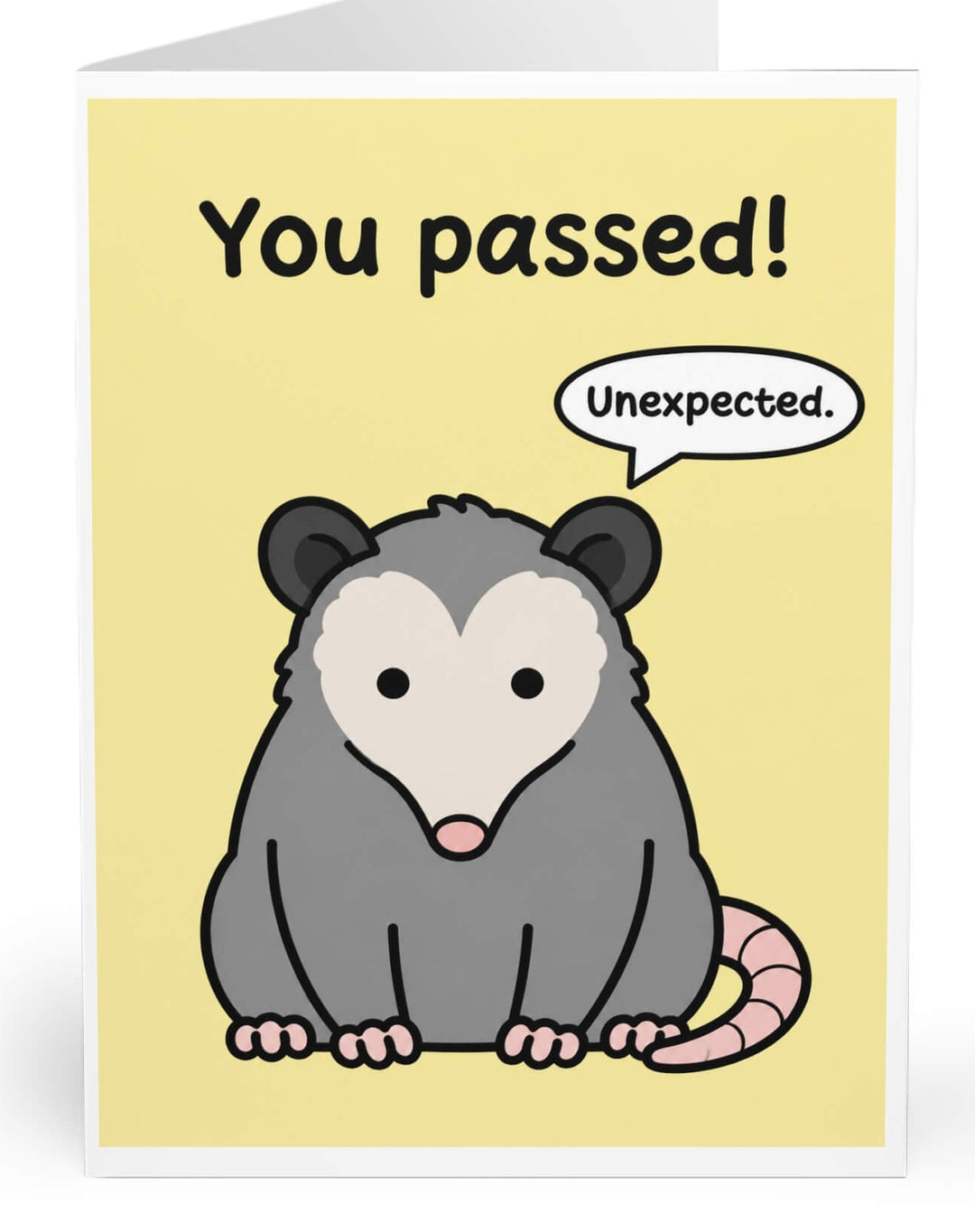 A folded greeting card shown standing upright on a white background. The card has a pale yellow front with the text &