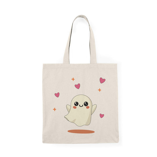 Tote bag featuring an adorable illustration of a cute ghost with a friendly smile and playful details. The whimsical design and soft colors create a charming accessory perfect for celebrating Halloween or adding a touch of spookiness to everyday style
