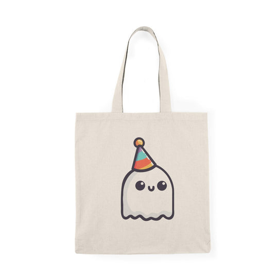 A cream-colored tote bag featuring a playful illustration of a cute ghost wearing a party hat, surrounded by colorful confetti. The text 'Party Ghost' adds a fun and festive touch, perfect for celebrating any occasion or Halloween